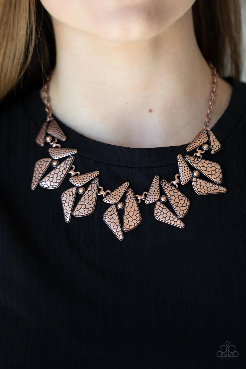 Paparazzi Accessories Extra Expedition - Copper Hammered and embossed in nature inspired patterns, mismatched triangular copper and studded frames delicately link below the collar for an adventurous look. Features an adjustable clasp closure. Sold as one