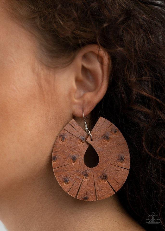 Paparazzi Accessories Palm Island - Brown Dotted in distressed textures, a brown leather teardrop is spliced into a trendy fringe-like pattern. Earring attaches to a standard fishhook fitting. Sold as one pair of earrings. Jewelry