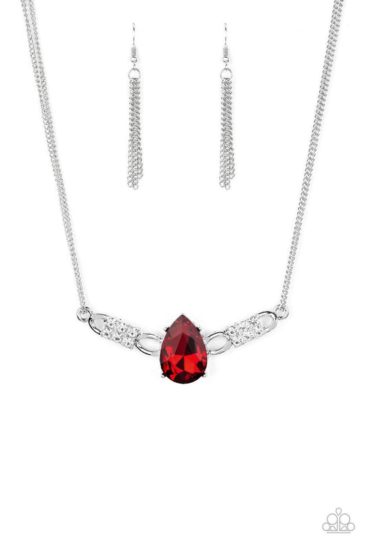 Paparazzi Accessories Way To Make An Entrance ~Red Cut into an alluring teardrop, an oversized red rhinestone gem attaches to bold silver frames radiating with glassy white rhinestones. The dramatic pendant attaches to doubled silver chains, swinging hori