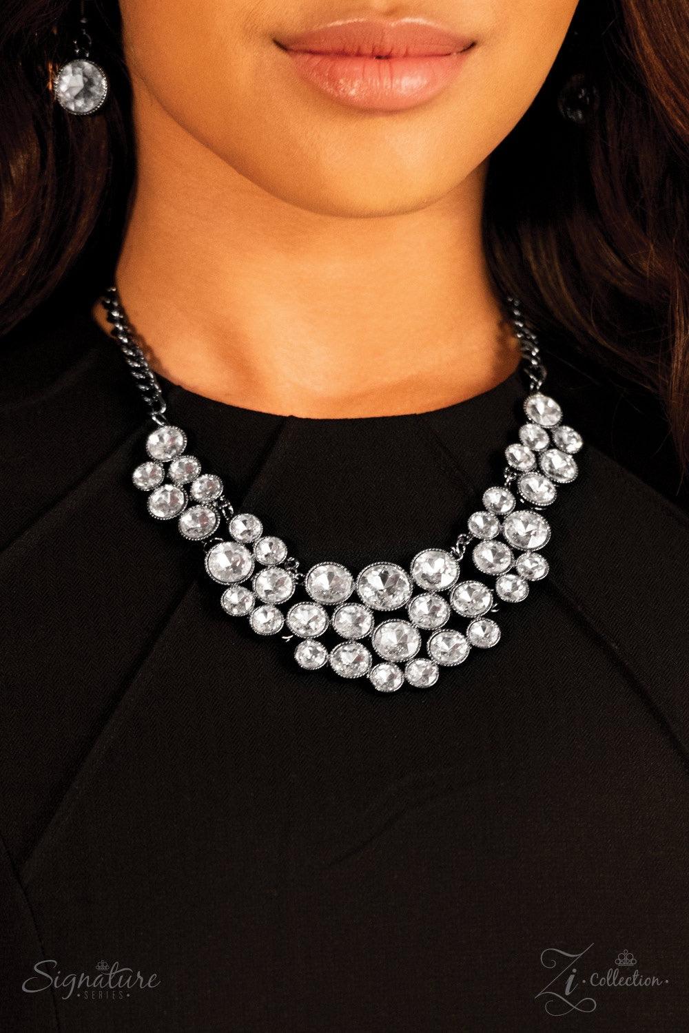 Paparazzi Accessories The Angela Oversized white rhinestones are pressed into studded gunmetal frames, creating a gorgeous collision of glamour and edge. The glittery gems are grouped in small clusters as they swing from a gunmetal chain, resulting in a f