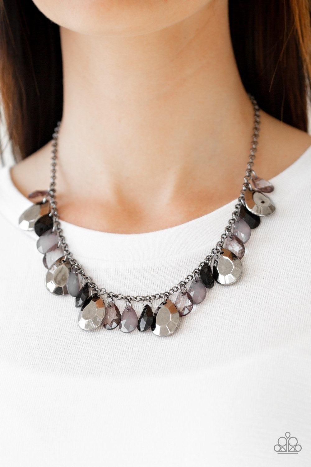 Paparazzi Accessories Hurricane Season - Black Teardrops - Gunmetal Chain Necklace and matching Earrings. Polished blackand smoky teardrops drip from the bottom of a shimmery gunmetal chain. Faceted gunmetal teardrops trickle between the colorful beading,