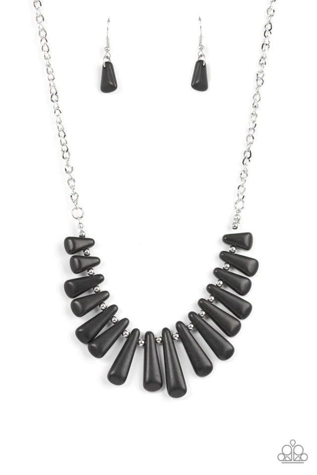 Paparazzi Accessories Mojave Empress - Black Separated by dainty silver beads, pieces of triangular cut black stones gradually increase in size as they fan out below the collar for an earthy statement. Features an adjustable clasp closure. Sold as one ind
