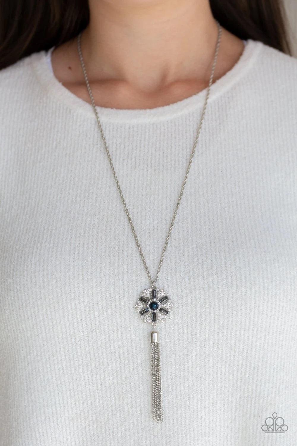 Paparazzi Accessories Fine Florals - Blue Dotted with a blue pearl center, a floral silver pendant radiating with glassy white and smoky rhinestones swings from the bottom of a lengthened silver chain. A shimmery silver tassel swings from the bottom of th