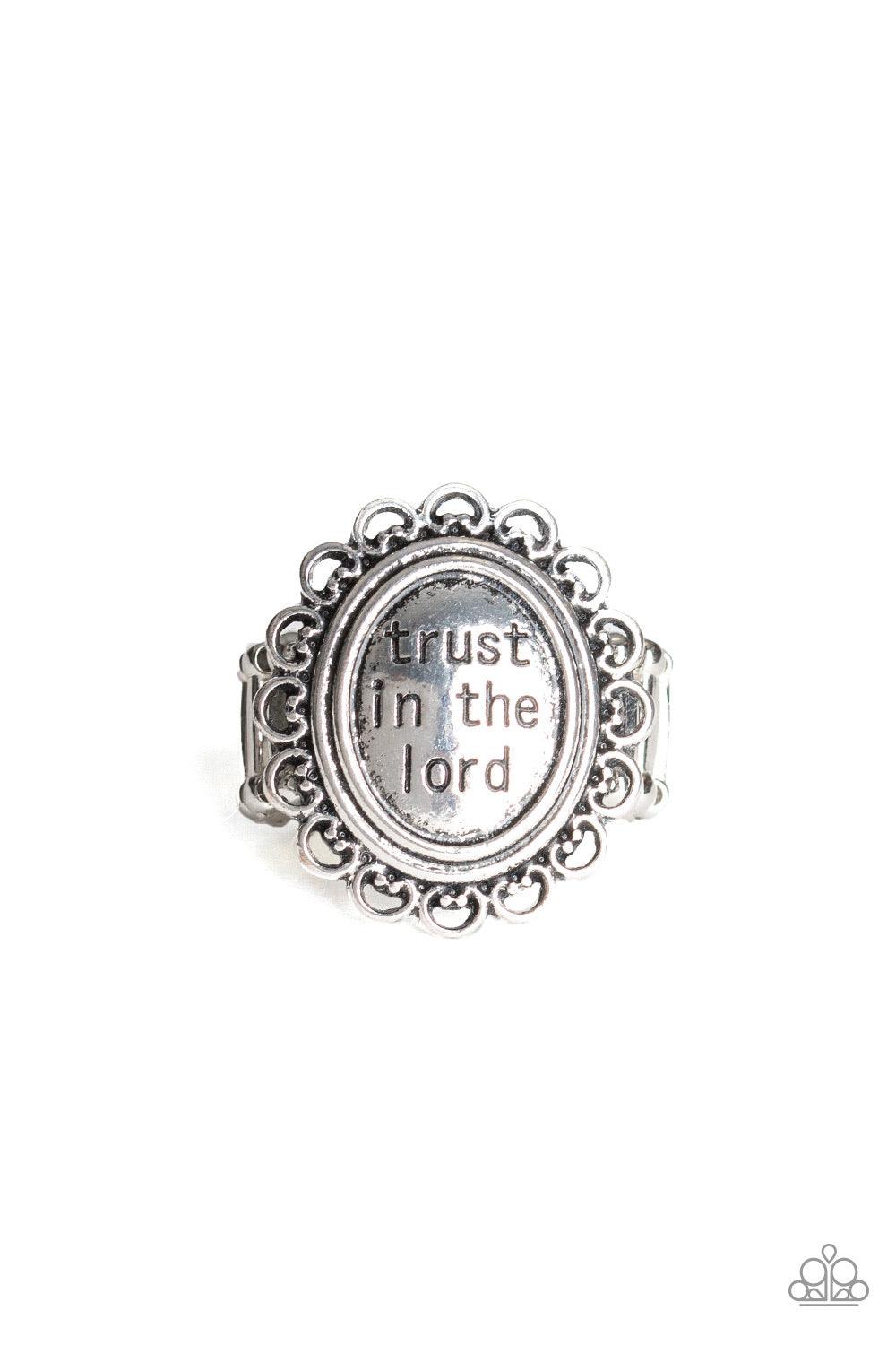 Paparazzi Accessories Trust ~Silver The enlightening phrase, "trust in the lord", is stamped in the center of a frilly silver frame for an inspiring look. Features a stretchy band for a flexible fit.