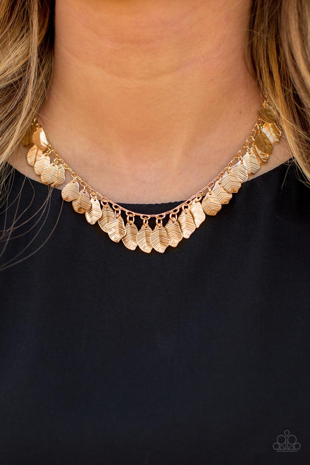 Paparazzi Accessories Sail Across The Sky - Gold Delicately etched in lifelike patterns, dainty gold feathers drip from the bottom of a glistening gold chain, creating a shimmery fringe below the collar. Features an adjustable clasp closure. Sold as one i