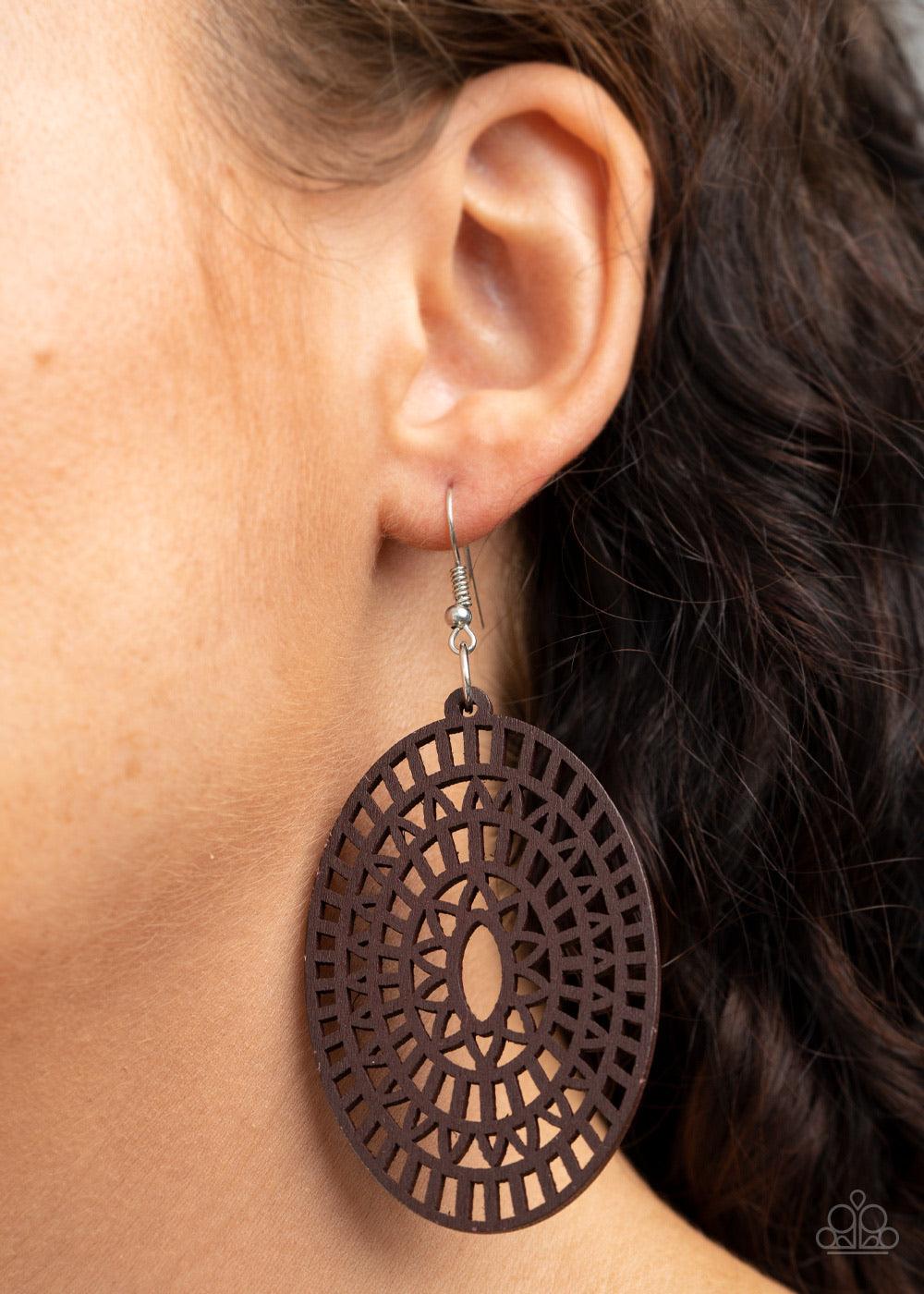 Paparazzi Accessories Tropical Retreat - Brown Painted in a natural brown finish, an oval wooden frame has been cut into an airy floral stencil for a seasonal flair. Earring attaches to a standard fishhook fitting. Sold as one pair of earrings. Jewelry