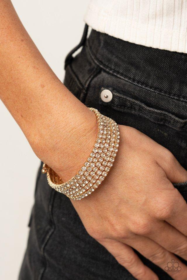 Paparazzi Accessories The GLOW-Digger - Gold Encased in glistening gold fittings, row after row of glassy white rhinestones coil around the wrist, creating a blinding infinity wrap bracelet. Jewelry