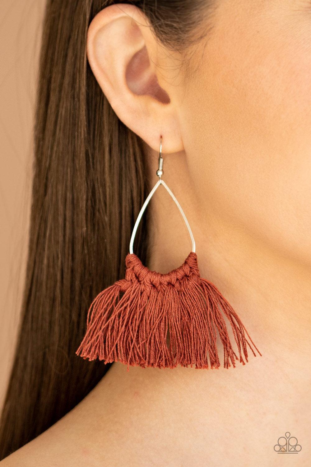 Paparazzi Accessories Tassel Treat - Brown Cinnamon Stick threaded tassels knot around the bottom of a shimmery silver teardrop frame, creating a spicy fringe. Earring attaches to a standard fishhook fitting. Jewelry