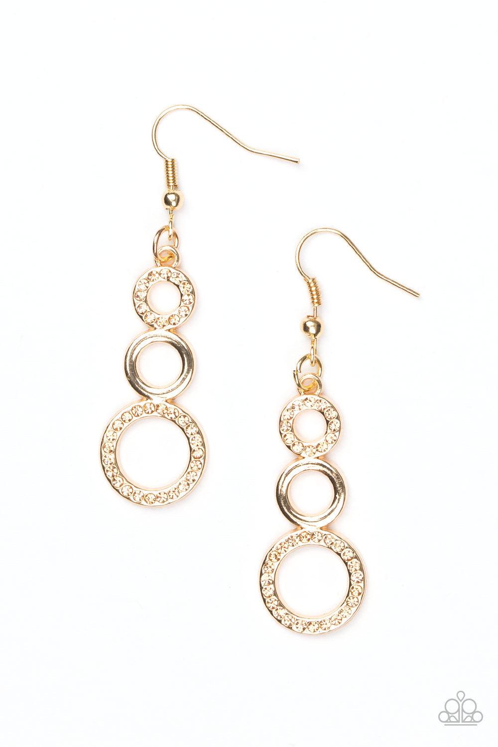 Paparazzi Accessories Bubble Bustle - Gold Alternating in glittery rhinestones, shiny gold circles gradually increase in size as they connect into a bubbly lure. Earring attaches to a standard fishhook fitting. Jewelry