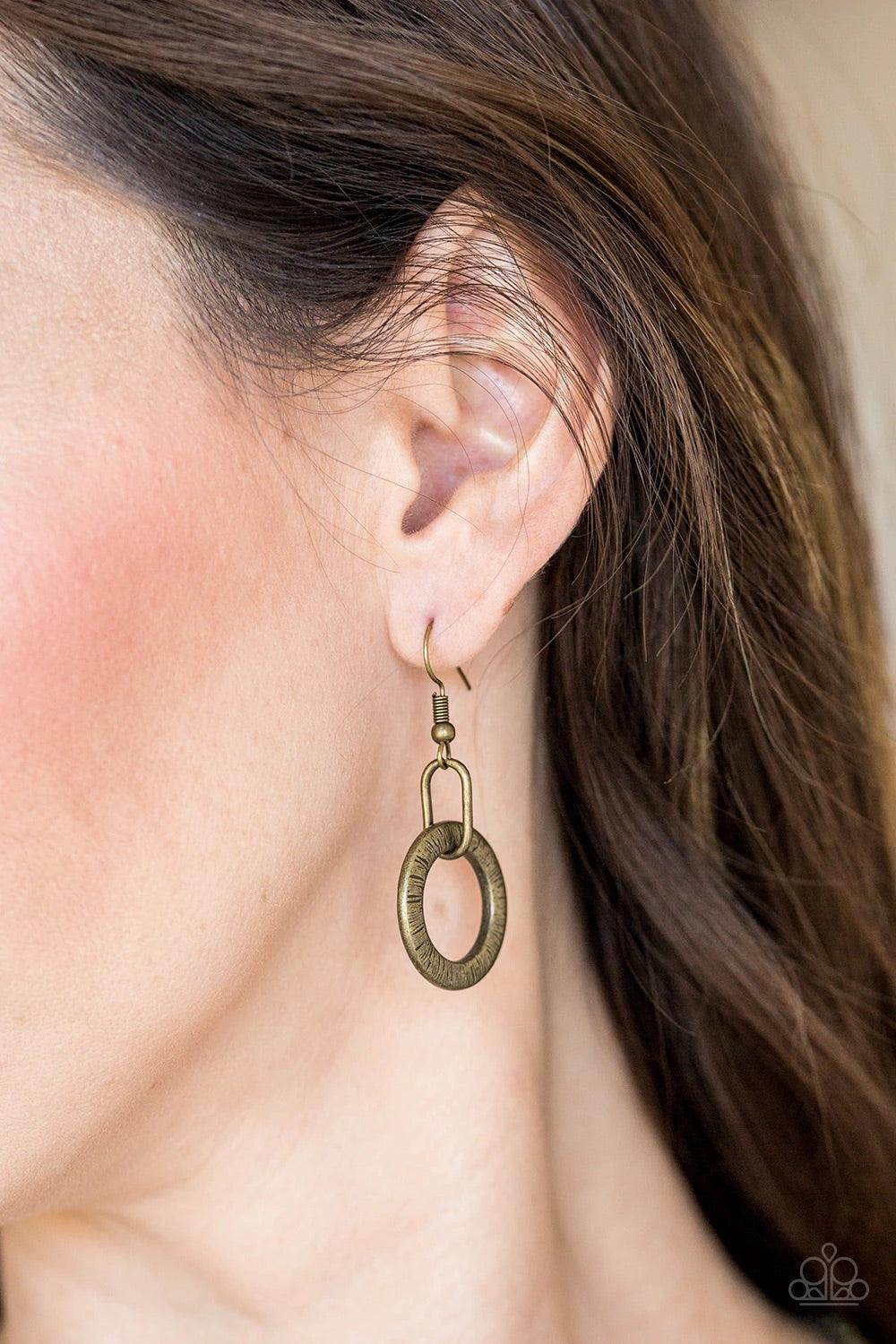 Paparazzi Accessories Modern Day Madonna - Brass Textured brass hoops and glittery hematite rhinestone encrusted hoops link below the collar for a sassy industrial look. Features an adjustable clasp closure. Sold as one individual necklace. Includes one p