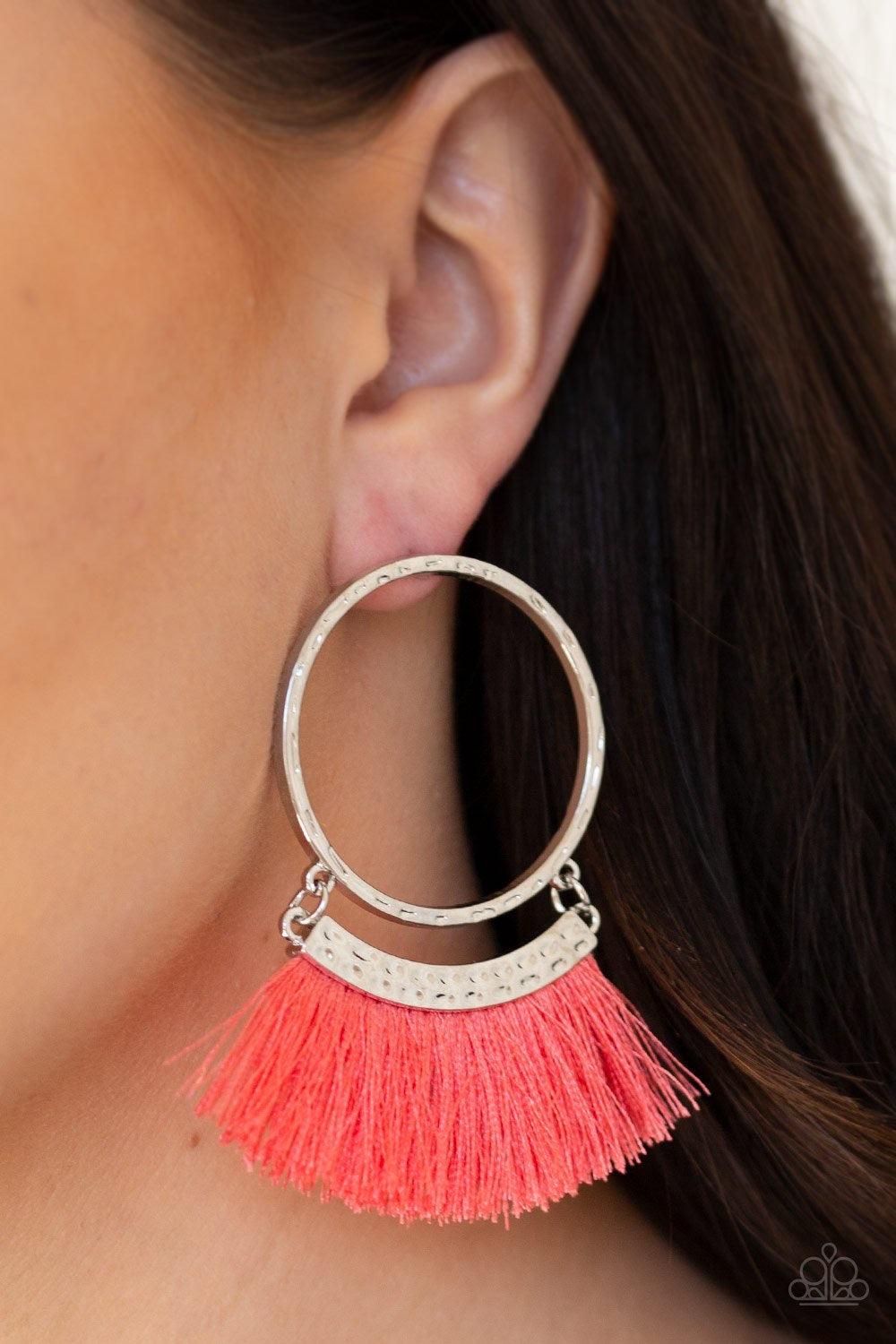 Paparazzi Accessories This is Sparta! - Orange Swinging from the bottom of a hammered silver hoop, shiny coral thread flares from a hammered silver frame for a tasseled look. Earring attaches to a standard post fitting. Sold as one pair of post earrings.