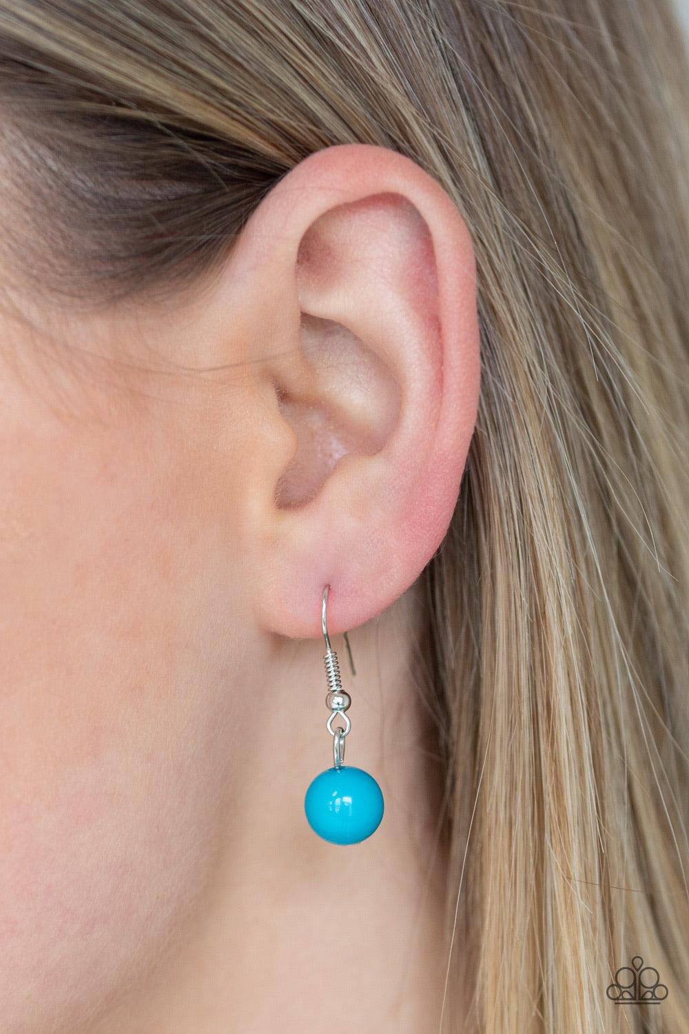 Paparazzi Accessories Brilliant Bliss - Blue A collection of glassy and polished blue beads trickle along rows of shimmery silver chains, creating colorful layers across the chest. Hammered silver hoops dot the bubbly layers, picking up and reflecting lig