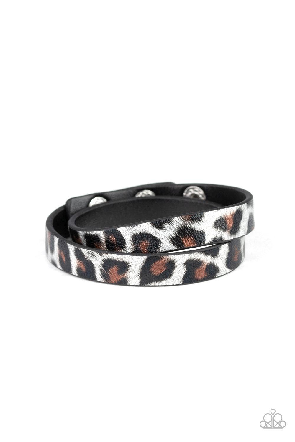 Paparazzi Accessories All GRRirl - Silver Featuring a black, brown, and silver cheetah pattern, a strip of black leather double wraps around the wrist for a wild look. Features an adjustable snap closure. Jewelry