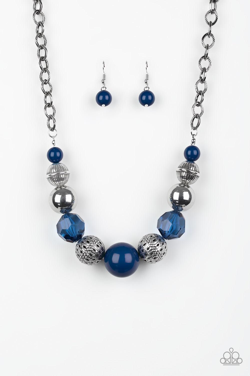 Paparazzi Accessories Sugar, Sugar - Blue A collection of antiqued silver beads, glassy blue crystal-like beads, and oversized blue beads are threaded along an invisible wire below the collar. Textured in linear patterns, an antiqued silver chain attaches
