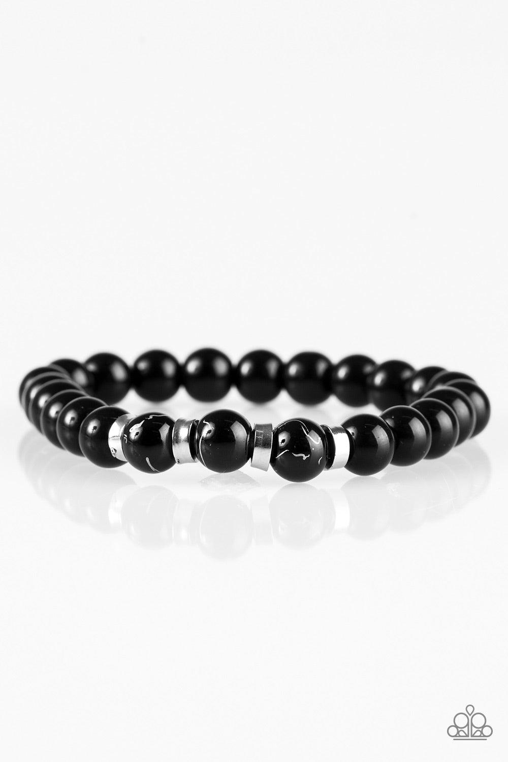 Paparazzi Accessories Composed - Black Glassy black beads are threaded along a stretchy elastic band for a seasonal look. Infused with silver accents, the shiny black beads are brushed in a metallic marble finish for an earthy finish. Jewelry