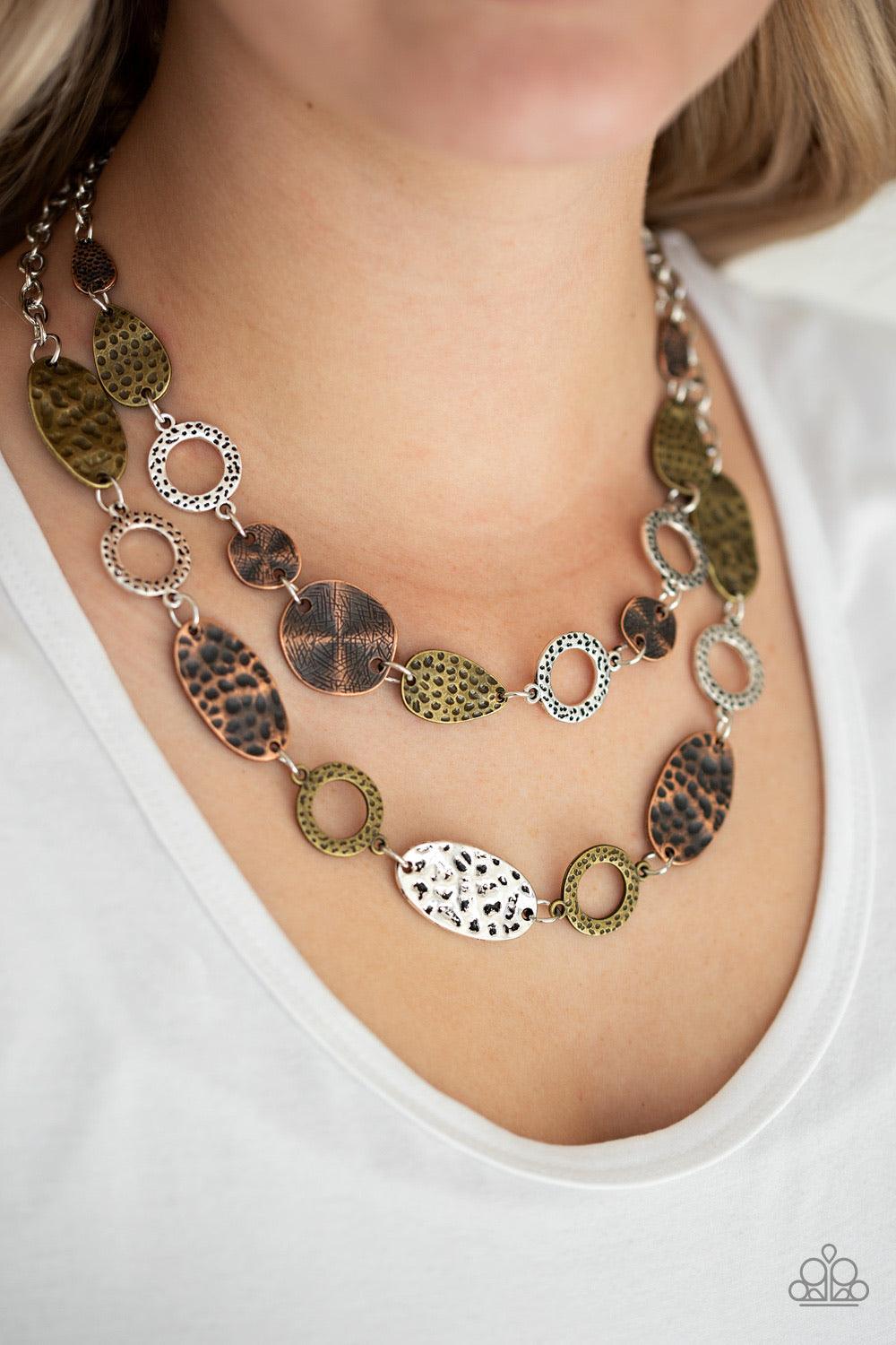 Paparazzi Accessories Trippin On Treasure ~Multi Delicately hammered in shimmery textures, mismatched brass, copper, and silver frames link below the collar in two seasonal layers. Features an adjustable clasp closure. Sold as one individual necklace. Inc
