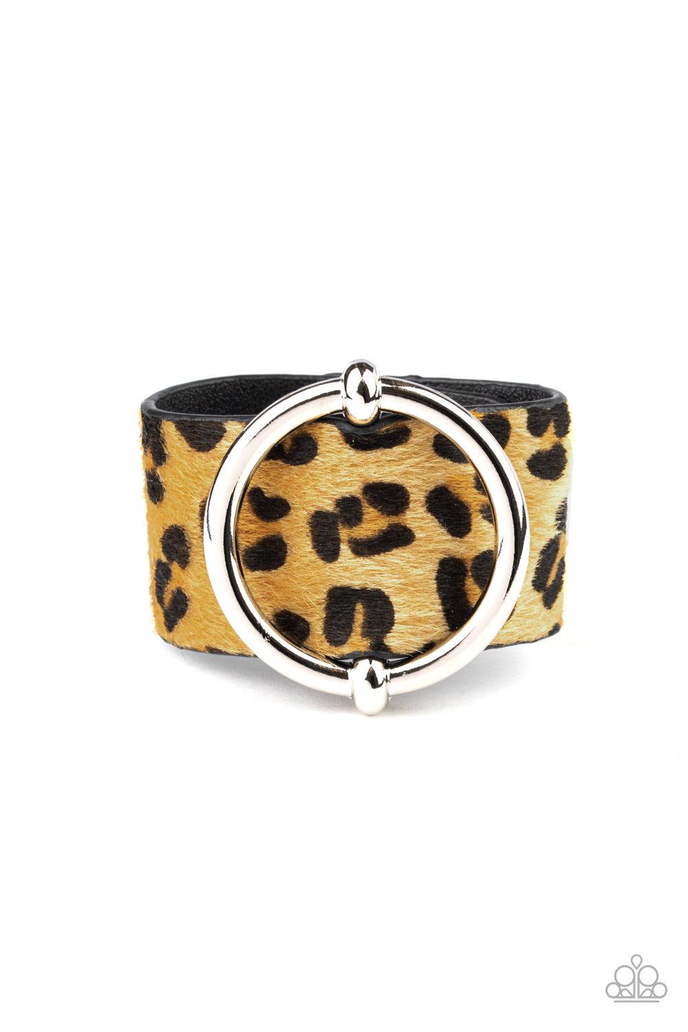 Paparazzi Accessories Asking FUR Trouble - Yellow A dramatically oversized silver ring slides along a thick black leather band featuring fuzzy yellow cheetah print for a wild finish. Features an adjustable snap closure. Sold as one individual bracelet. Je