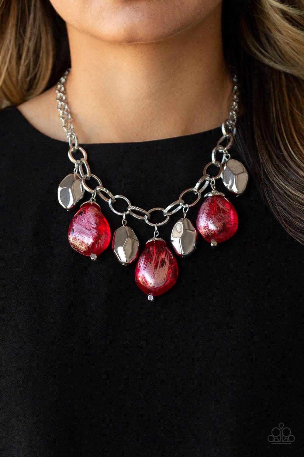 Paparazzi Accessories Looking Glass Glamorous - Red Brushed in a metallic shimmer, oversized glassy red beads and faceted silver beads dangle from the bottom of an oversized silver chain below the collar for a dramatic fringe. Features an adjustable clasp