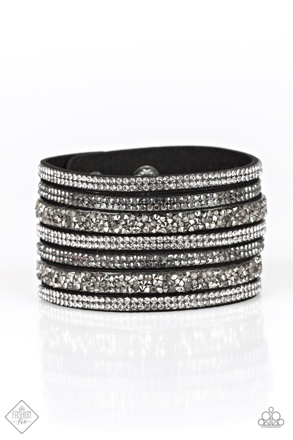 Paparazzi Accessories Rebellious Shine - Black Featuring classic round and edgy prism style cuts, row after row of smoky and hematite rhinestones stack across the wrist for a sassy look. Features an adjustable snap closure. Jewelry