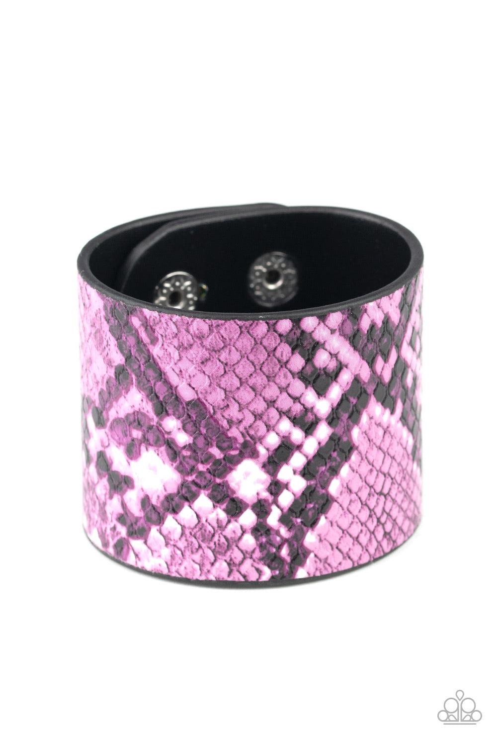 Paparazzi Accessories The Rest Is HISS-tory - Purple Featuring vibrant purple and white python print, a thick black leather band wraps around the wrist for a wild fashion. Features an adjustable snap closure. Jewelry