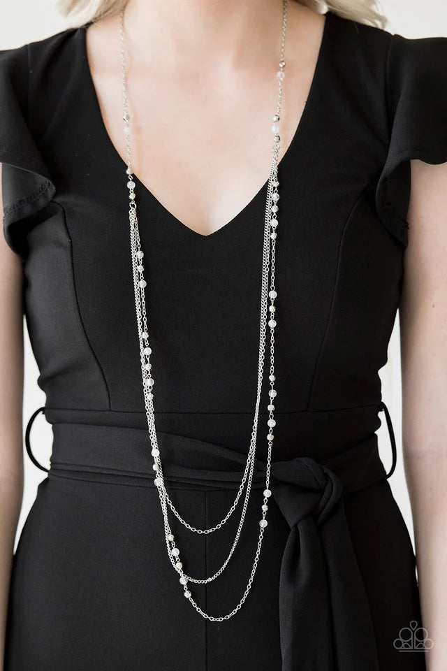 Paparazzi Accessories Colorful Cadence - White Faceted silver and glassy white beads trickle along shimmery silver chains down the chest for a whimsical look. Features an adjustable clasp closure. Jewelry