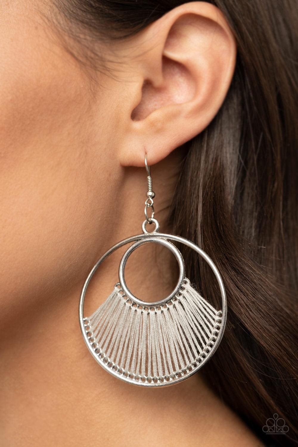 Paparazzi Accessories Really High-Strung - Silver Shiny Sleet thread loops through the bottoms of a small and large silver hoop, creating a colorfully fanned-out pattern. Earring attaches to a standard fishhook fitting. Sold as one pair of earrings. Jewel