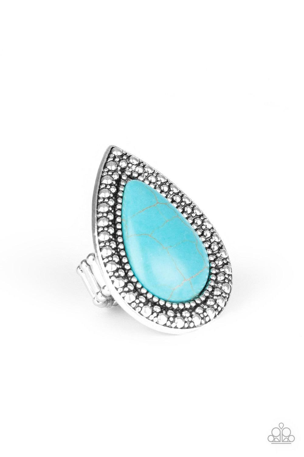 Paparazzi Accessories Santa Fe Storm - Blue Chiseled into a tranquil teardrop, an oversized turquoise stone is pressed into the center of a shimmery silver frame dotted with radiant studded texture for a dramatic stone look. Features a stretchy band for a