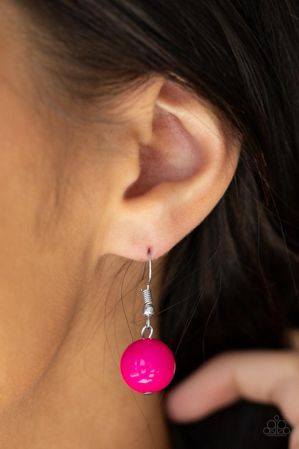 Paparazzi Accessories South Shore Sensation - Pink Dramatic silver, vibrant pink, and faceted cloudy beads are threaded along an invisible wire below the collar for a seasonal look. Features an adjustable clasp closure. Jewelry