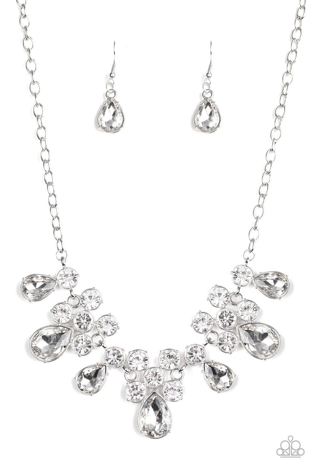 Paparazzi Accessories Debutante Drama - White A collection of round and teardrop white rhinestones coalesce into dazzling frames as they link below the collar, creating a glamorous fringe. Features an adjustable clasp closure. Jewelry