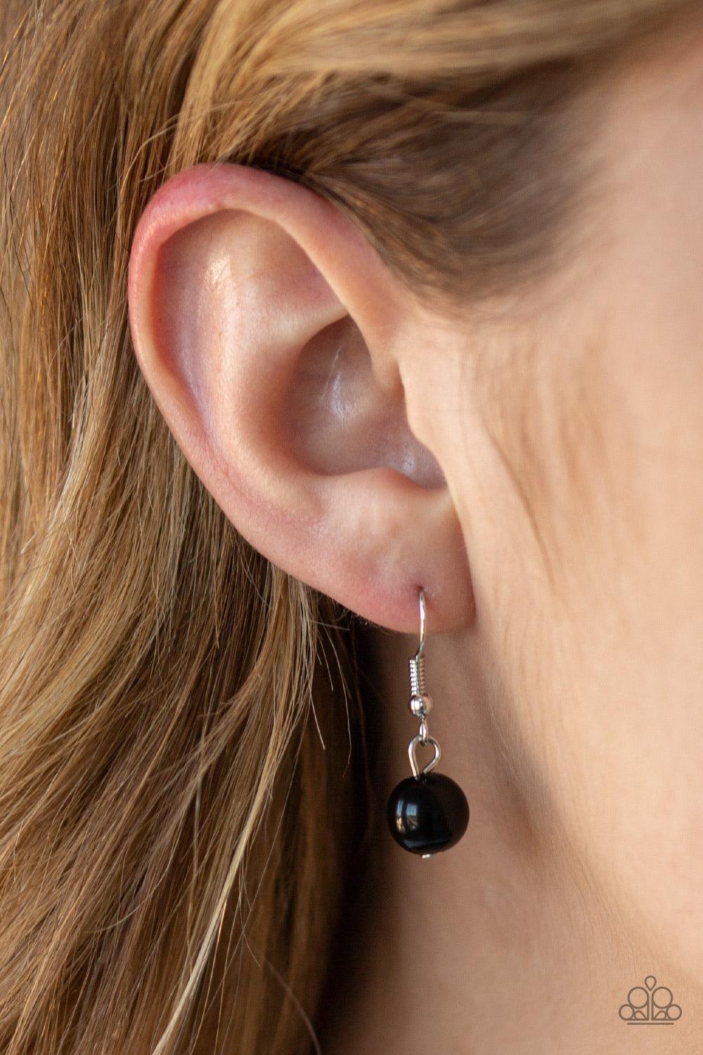 Paparazzi Accessories Uptown Heiress - Black Infused with dainty silvery rhinestone encrusted beads, a refined collection of oversized black beads are threaded along an invisible wire below the collar for a timeless dazzle. Features an adjustable clasp cl