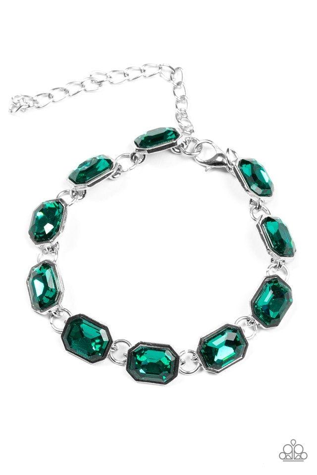 Paparazzi Accessories Deluxe Sparkle - Green Featuring regal emerald style cuts, glittery green gems link across the wrist in an undeniably sparkly fashion. Features an adjustable clasp closure. Jewelry