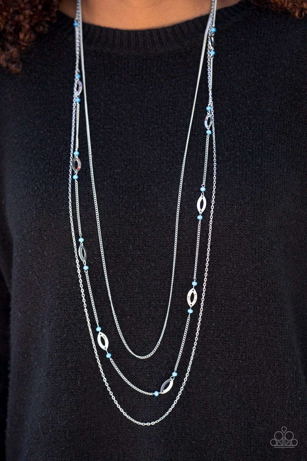 Paparazzi Accessories Afternoon Glow - White Mismatched silver chains layer down the chest. Sections of shimmery silver marquises frame and glowing white beads trickle along the centermost chain for a seasonal finish. Features an adjustable clasp closure.