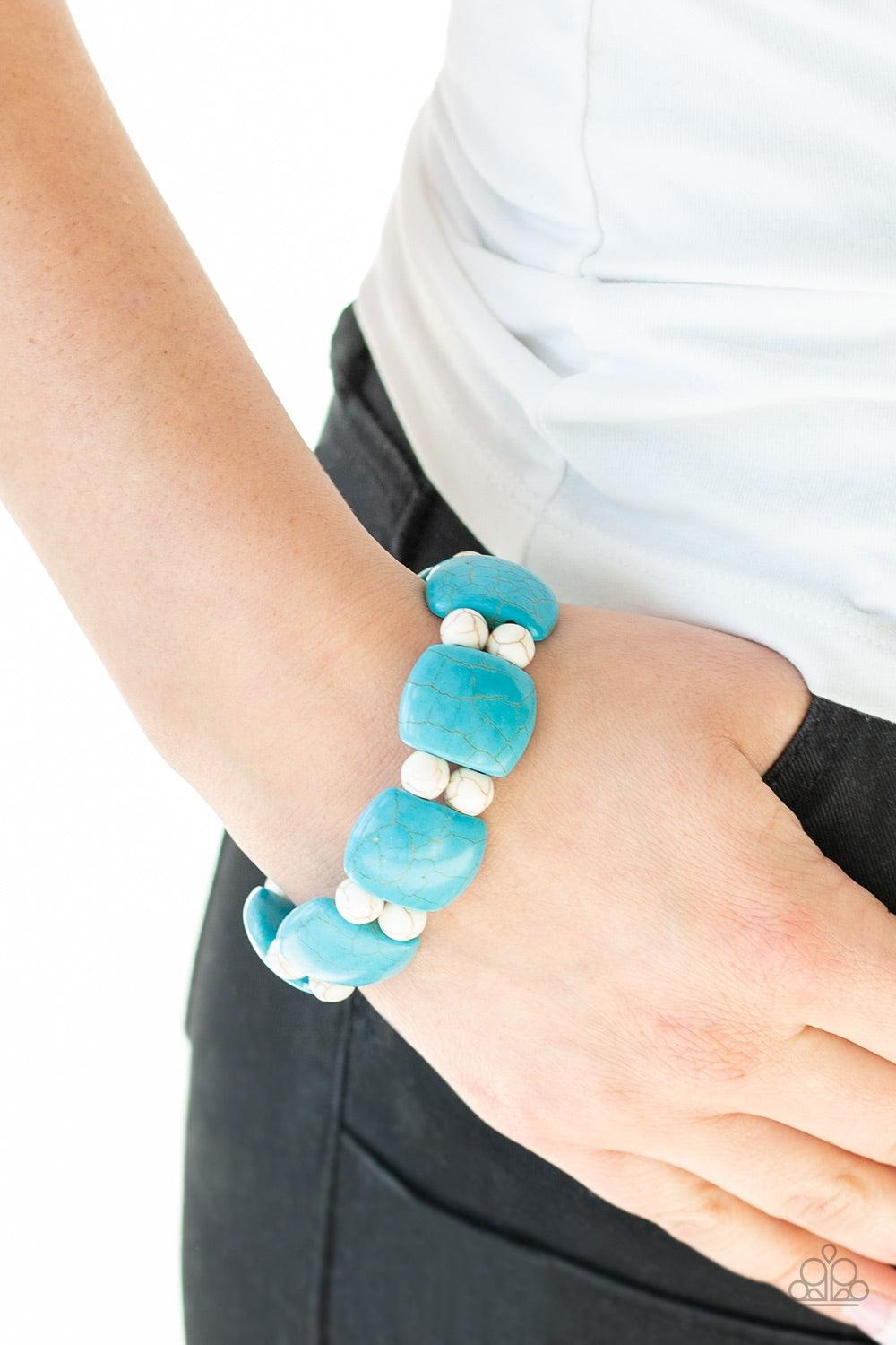 Paparazzi Accessories Don’t Be So NOMADIC - Blue A collection of round white stone beads and square-like turquoise stones are threaded along stretchy bands around the wrist for a seasonal look. Jewelry