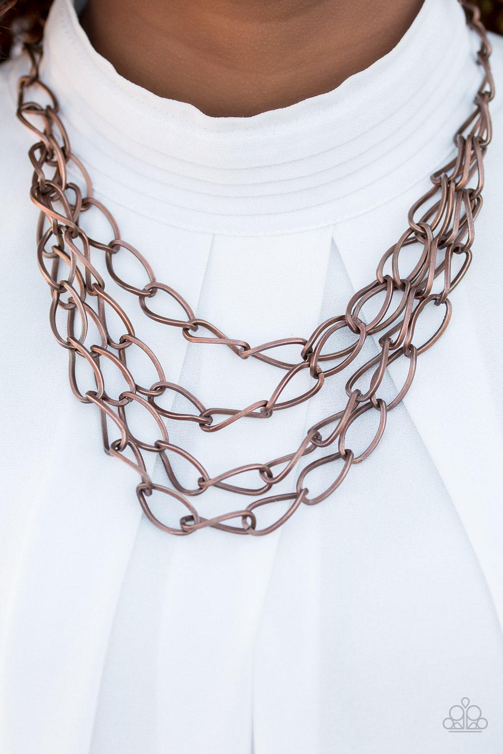 Paparazzi Accessories Chain Reaction - Copper Featuring a subtle twist, glistening copper links join below the collar in four bold layers for a fierce industrial look. Features an adjustable clasp closure. Sold as one individual necklace. Includes one pai