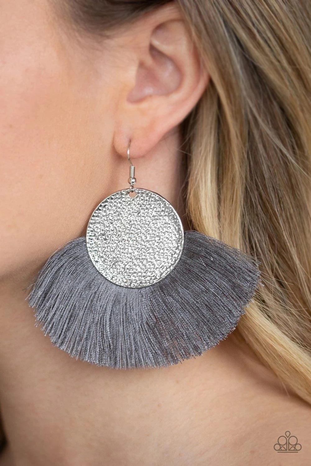 Paparazzi Accessories Foxtrot Fringe - Silver A fan of shiny gray thread flares out from the bottom of a hammered silver disc, creating a foxy fringe. Earring attaches to a standard fishhook fitting. Sold as one pair of earrings. Jewelry