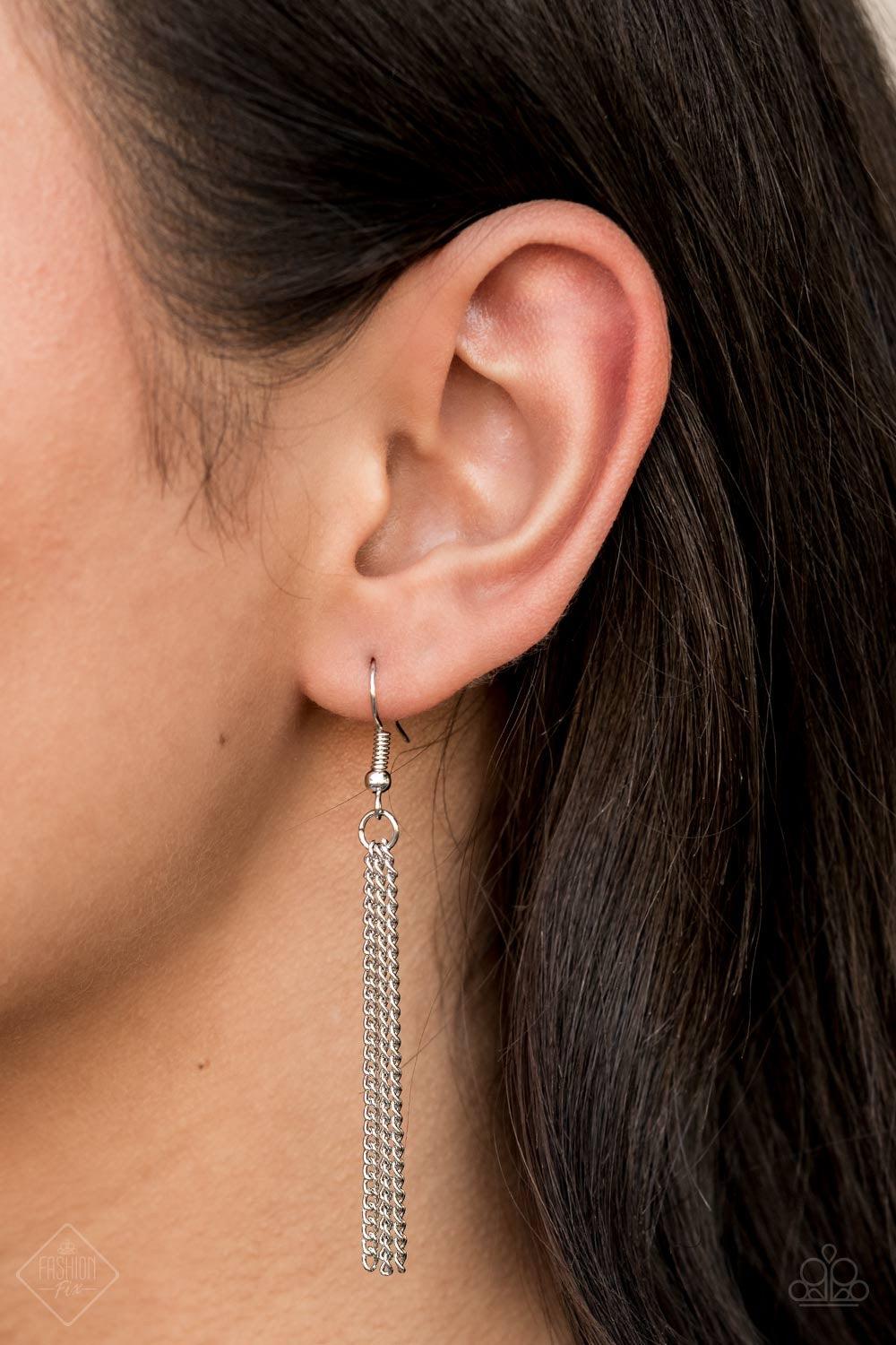Paparazzi Accessories Tassel Tycoon - Silver Silver beads encircled by rhinestones are nestled inside a row of three vintage frames that cascade down the chest at the bottom of an elongated silver chain. Glistening silver chains stream from the bottom of