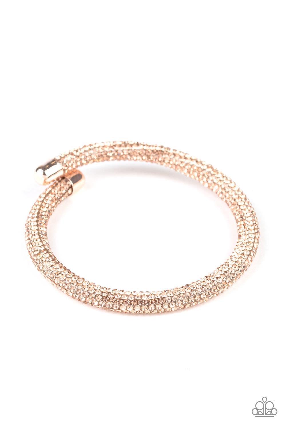 Paparazzi Accessories Stageworthy Sparkle - Gold Bedazzled in sparkling rhinestones, a bendable cuff-like bracelet delicately curls around the wrist for a refined look. Jewelry