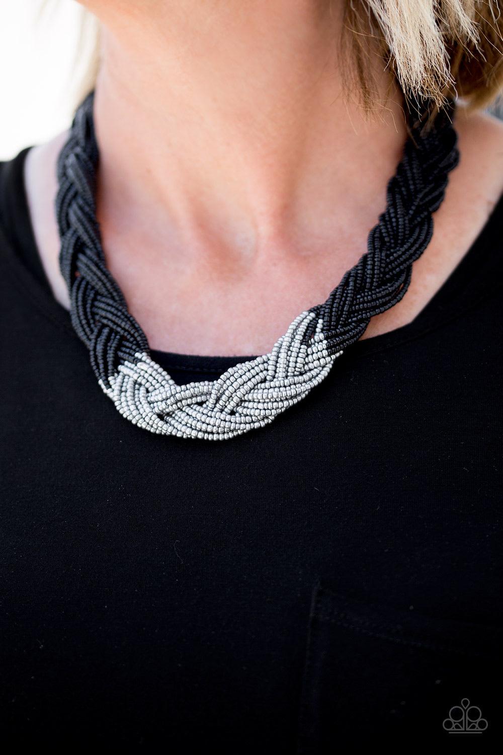 Paparazzi Accessories Brazilian Brilliance - Black Strands of black seed beads create an indigenous braid below the collar. The black seed beads gradually morph into silvery metallic beads at the center for a chic contrasting look. Features an adjustable