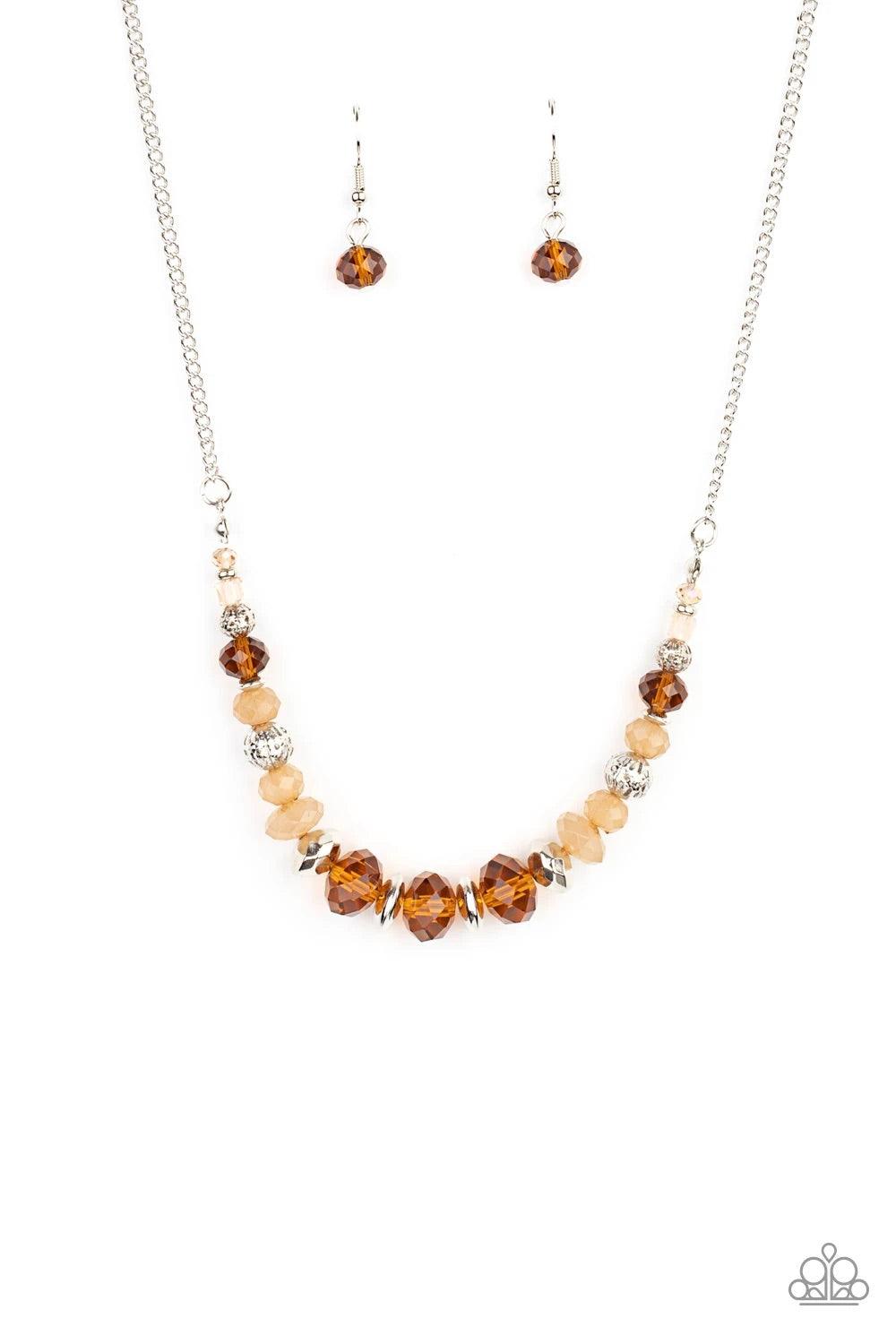 Paparazzi Accessories Turn Up The Tea Lights - Brown A fiery collection of red teardrop stones fan out from a textured silver ring, creating a scalloped floral frame at the bottom of a round red stone dotted frame. Earring attaches to a standard fishhook