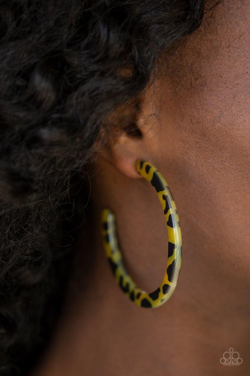 Paparazzi Accessories HAUTE Blooded - Yellow Featuring a tortoise-shell like pattern, a yellow acrylic frame curls around the ear for a retro flair. Earring attaches to a standard post fitting. Hoop measures 2 1/2" in diameter. Sold as one pair of hoop ea
