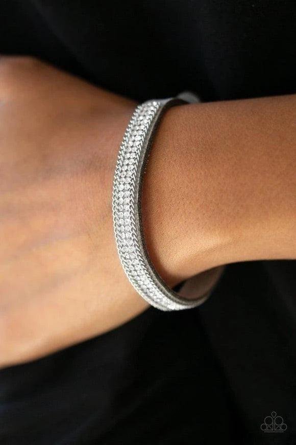 Paparazzi Accessories Babe Bling - Silver A skinny strand of gray suede is encrusted in rows of glittery white rhinestones and shimmery silver chains for a sassy look. Features an adjustable clasp closure.Sold as one individual bracelet. Jewelry
