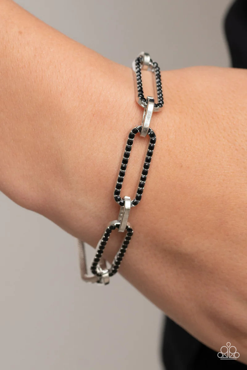 Paparazzi Accessories Still Not OVAL You - Black Dotted in dainty black rhinestones, oblong silver frames link with shiny silver fittings around the wrist for a timeless twinkle. Features an adjustable clasp closure. Sold as one individual bracelet. Jewel