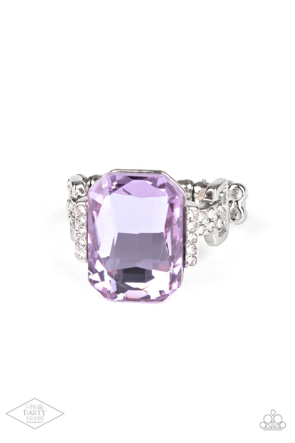 Paparazzi Accessories You Can COUNTESS On Me - Purple Featuring a regal emerald cut, a dramatically oversized purple rhinestone is flanked by dainty silver frames encrusted in glassy white rhinestones for a refined flair. Features a stretchy band for a fl
