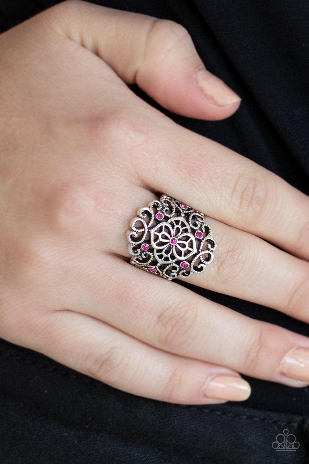 Paparazzi Accessories Grenada Gardens - Pink Dainty pink rhinestones are sprinkled along a frilly silver frame swirling with airy filigree for a refined flair. Features a stretchy band for a flexible fit. Jewelry
