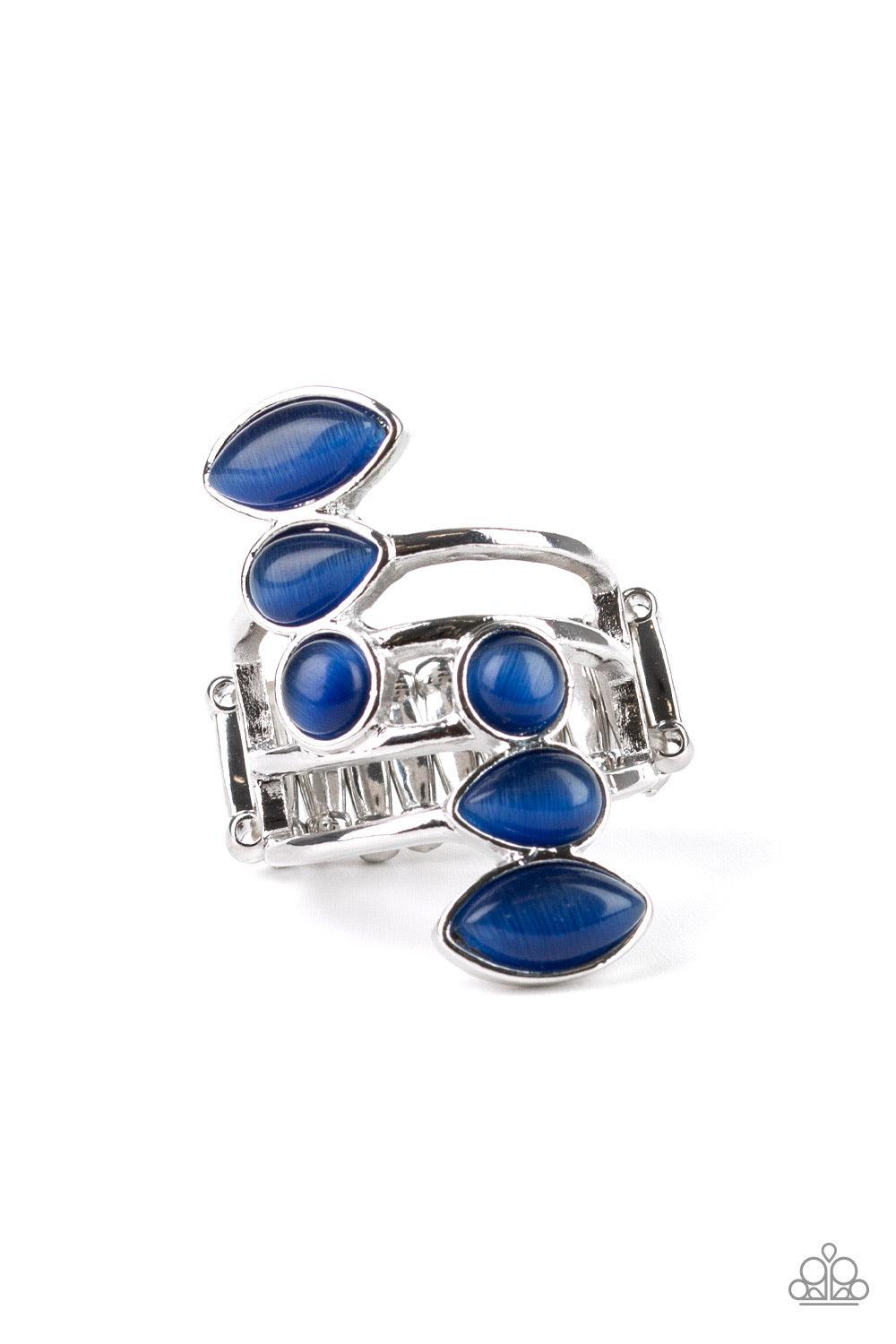 Paparazzi Accessories Wraparound Radiance ~Blue Featuring round, teardrop, and marquise shapes, two frames of glowing blue cat's eye stones stack across a layered silver band for an all around radiance. Features a stretchy band for a flexible fit.