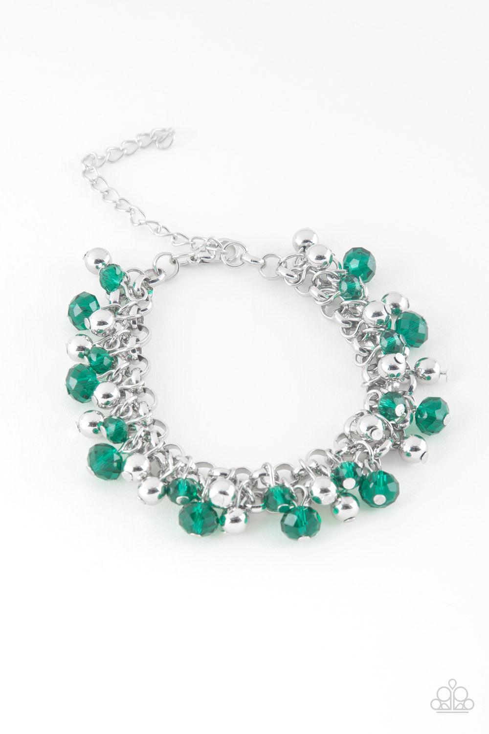 Paparazzi Accessories Just For The FUND Of It! - Green Faceted green crystal-like beads and classic silver beads swing from interlocking silver chains, creating a refined fringe around the wrist. Features an adjustable clasp closure. Jewelry