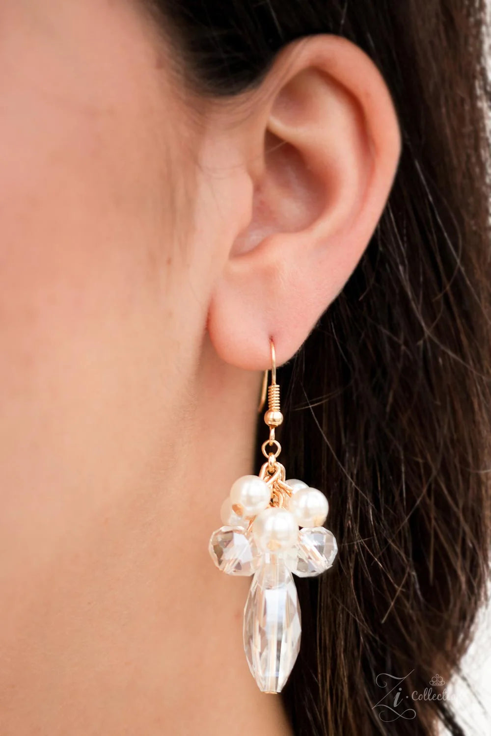 Paparazzi Accessories Captivate An oversized gold chain gives way to an exaggerated cluster of bubbly white pearls, glassy crystal-like beads, and prismatic crystal teardrops. The dramatic fringe converges below the collar, creating a breathtaking stateme