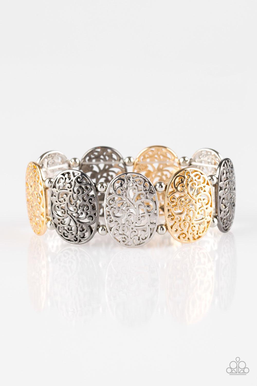 Paparazzi Accessories Everyday Elegance - Multi Brushed in a high-sheen finish, vine-like filigree climbs glistening gunmetal, gold and silver frames. Infused with dainty silver beads, the elegant frames are threaded along stretchy bands, creating a refin