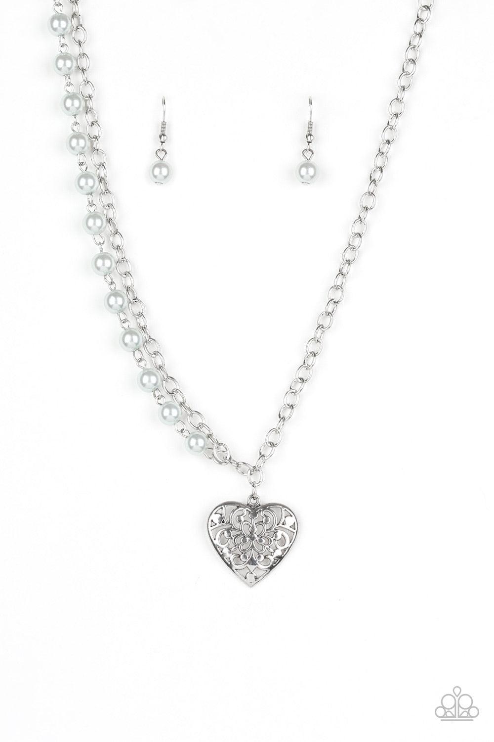 Paparazzi Accessories Forever In My Heart - Silver Swirling with filigree details, a whimsical heart pendant swings from the bottom of a shimmery silver chain below the collar. A single strand of pearly silver beads drape down one side for a refined asymm