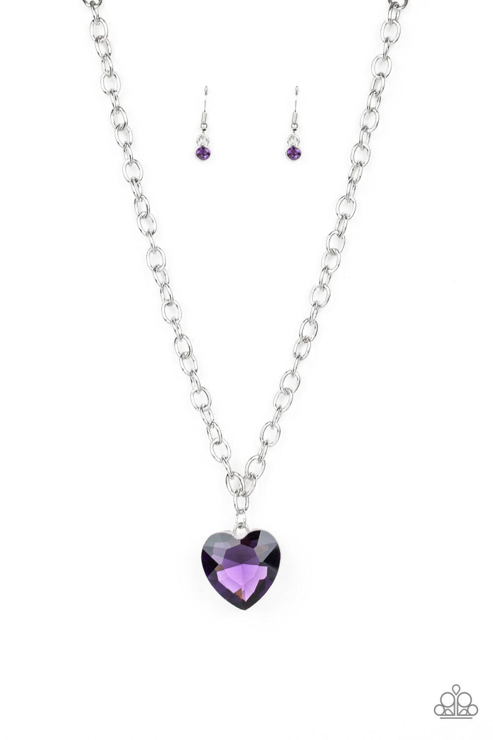 Paparazzi Accessories Flirtatiously Flashy - Purple Set atop a sleek silver fitting, a glittery purple heart-shaped gem swings from the bottom of a classic silver chain below the collar for a whimsical look. Features an adjustable clasp closure. Jewelry